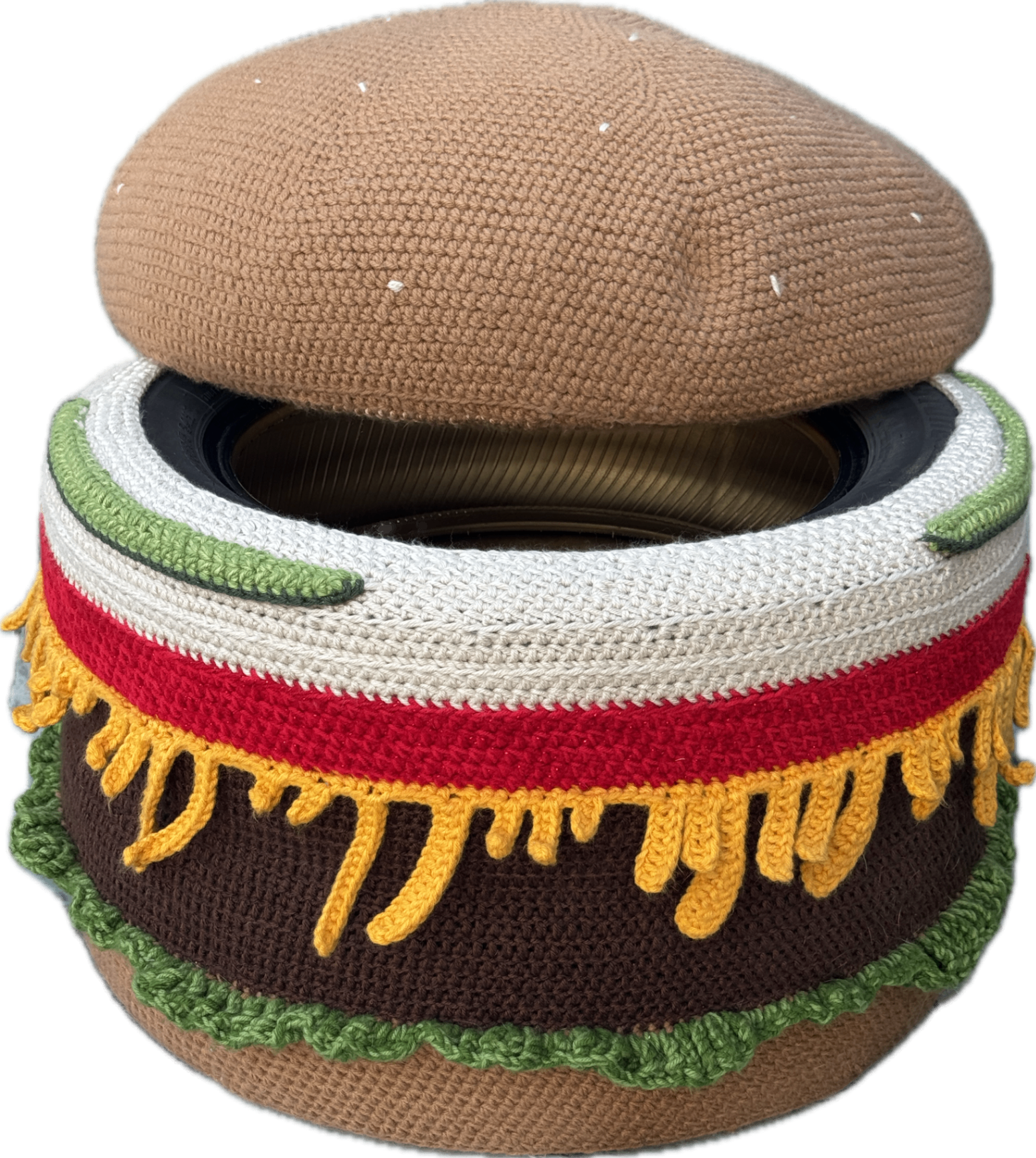 The burger ottoman with its lid slightly open, showing it opens for storage.